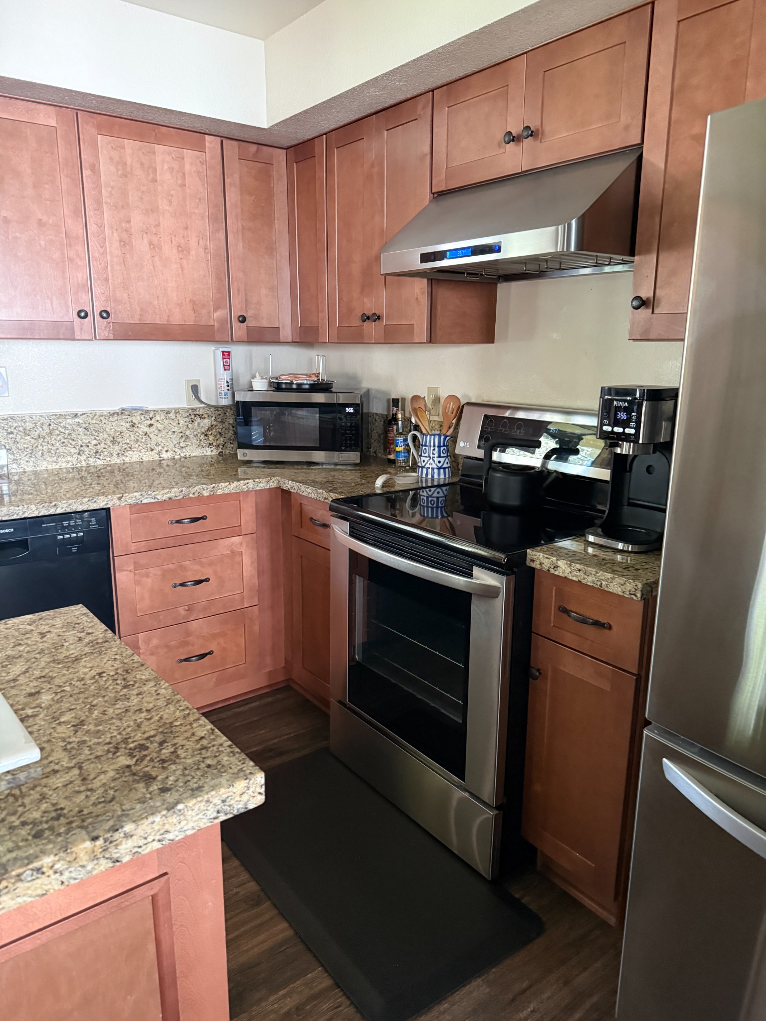 Updated kitchen with granite counters and stainless appliances